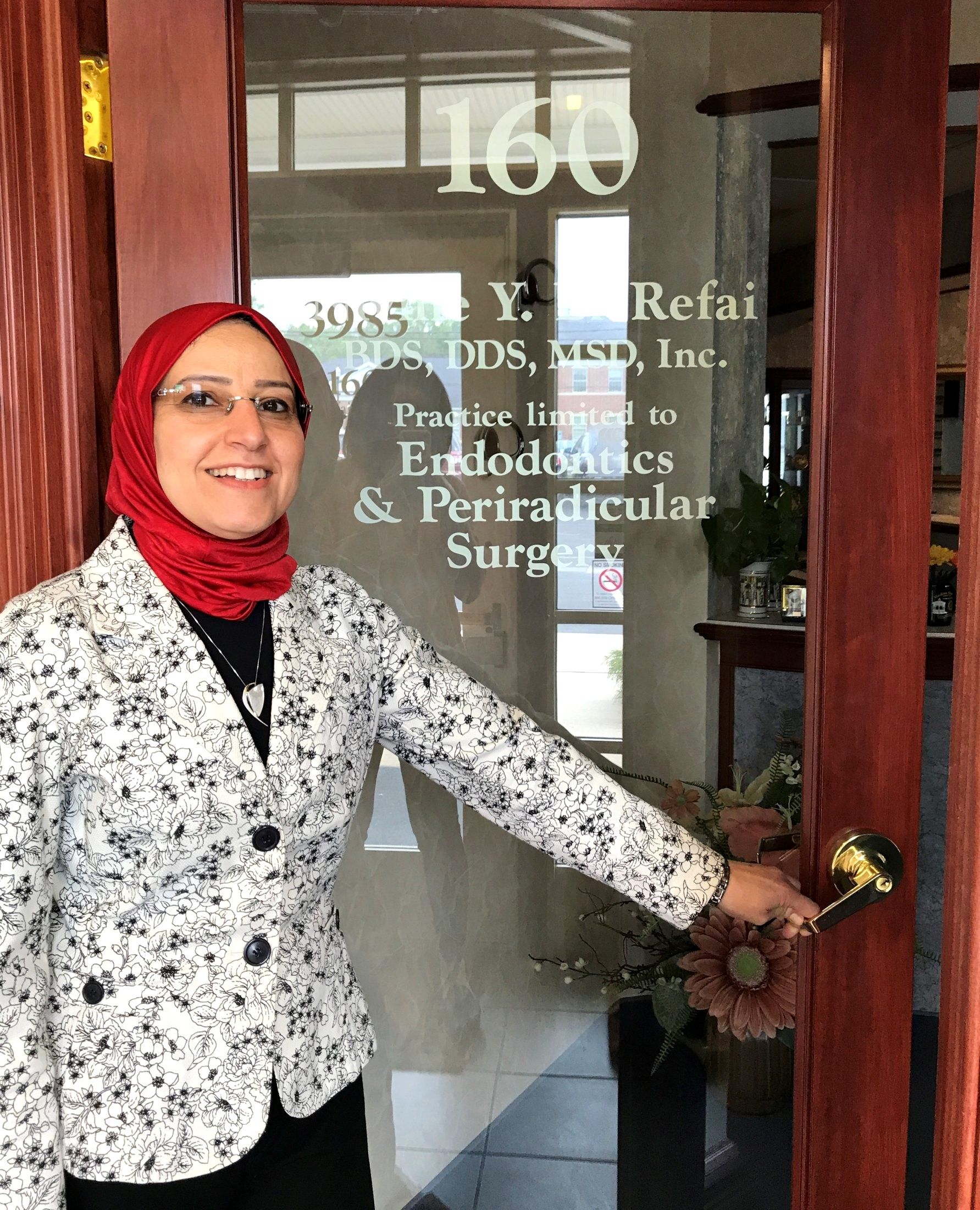 Dr. El-Refai welcoming patients at the office door